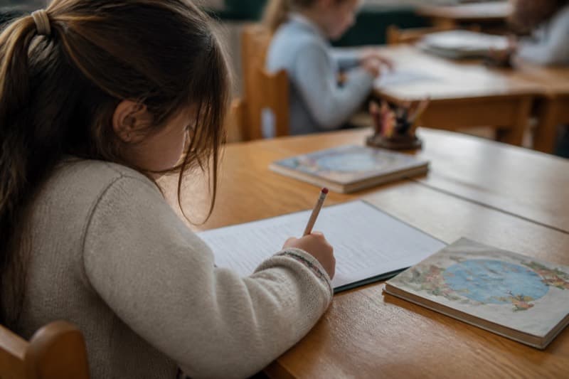 Teacher using spelling test generator on computer